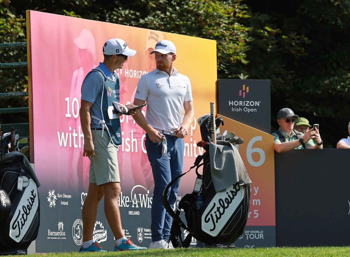 John Murphy and caddie Shane O'Connell discussing options at the Horizon Irish Open.