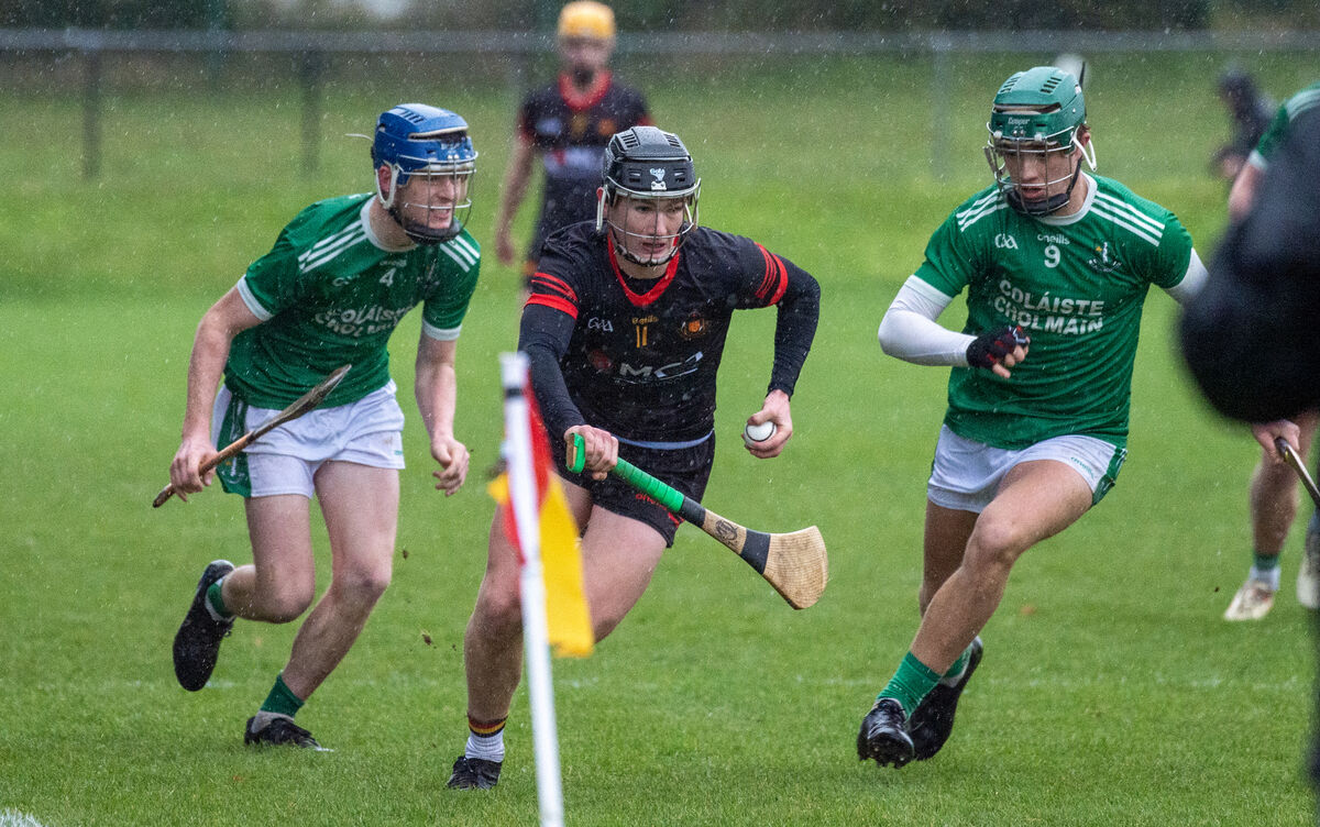  Darragh O'Brien and Brian McGrath of St Colman's College looking to tackle the breaking Ben Mayer of Christian Brothers College. Picture: Dan Linehan