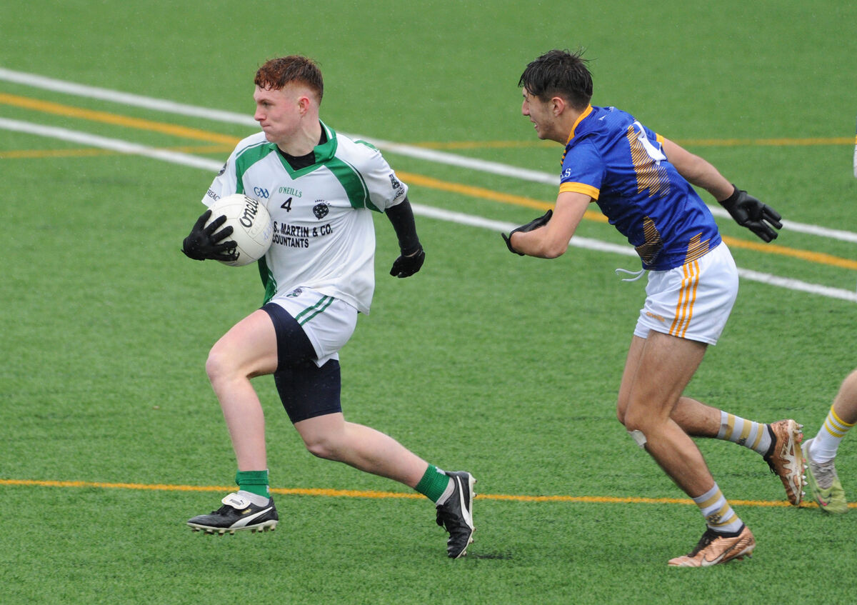 Emmet Bonner of Abbey CBS racing past Danny Crowley of Hamilton High School in the Corn Uí Mhuirí at Banteer.