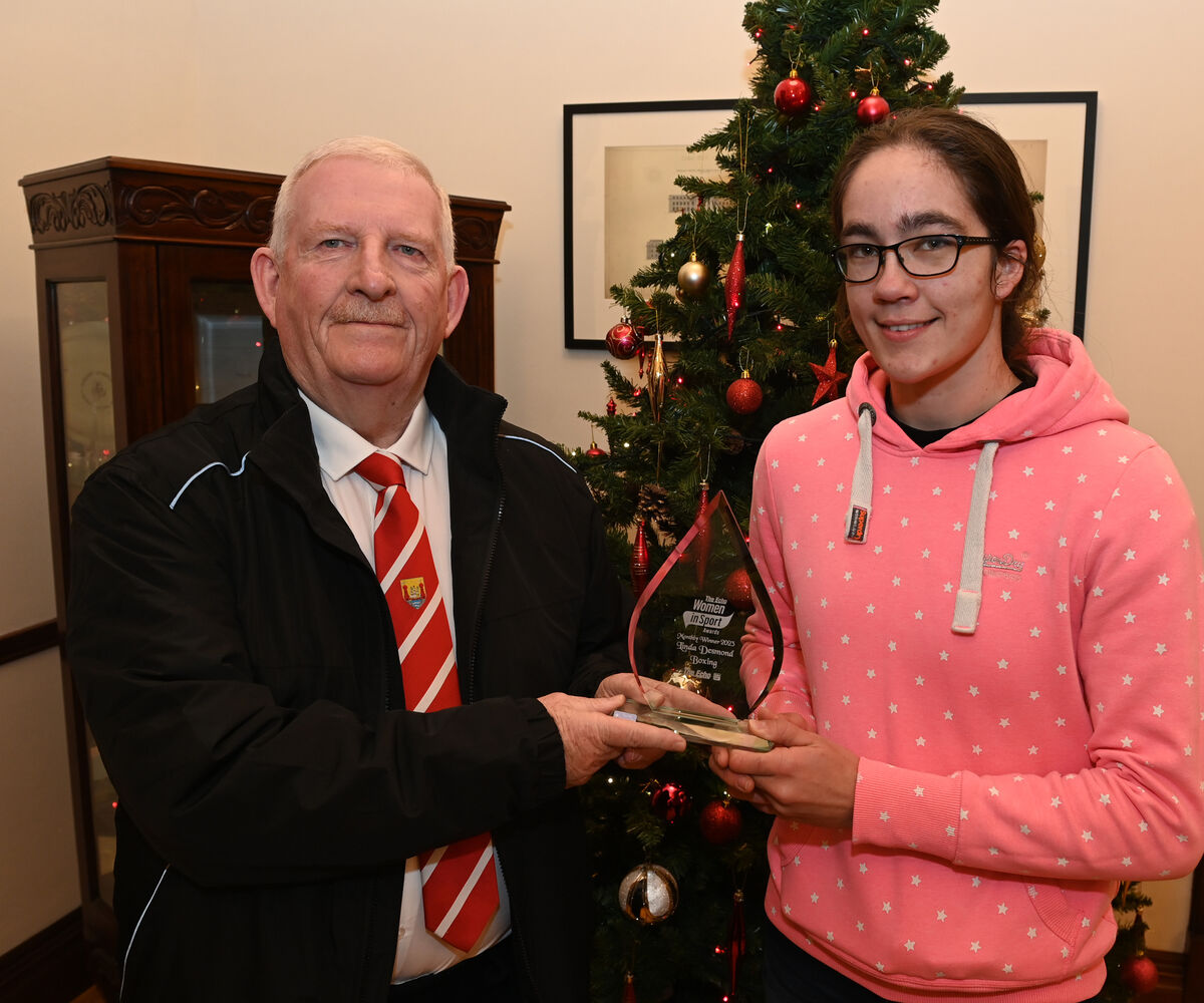  The Echo Women in Sport Monthly Award winner Linda Desmond of Rylane Boxing Club is presented with her trophy by Mick O'Brien, President Cork County Boxing Board. Picture: Larry Cummins