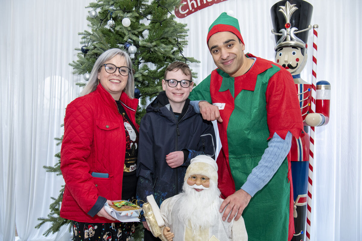 Mum Laurane Foley and her son Alex with Santa's helper at the Christmas Experience. Pic: Brian Lougheed Mum Laurane Foley and her son Alex with Santa's helper at the Christmas Experience. Pic: Brian Lougheed