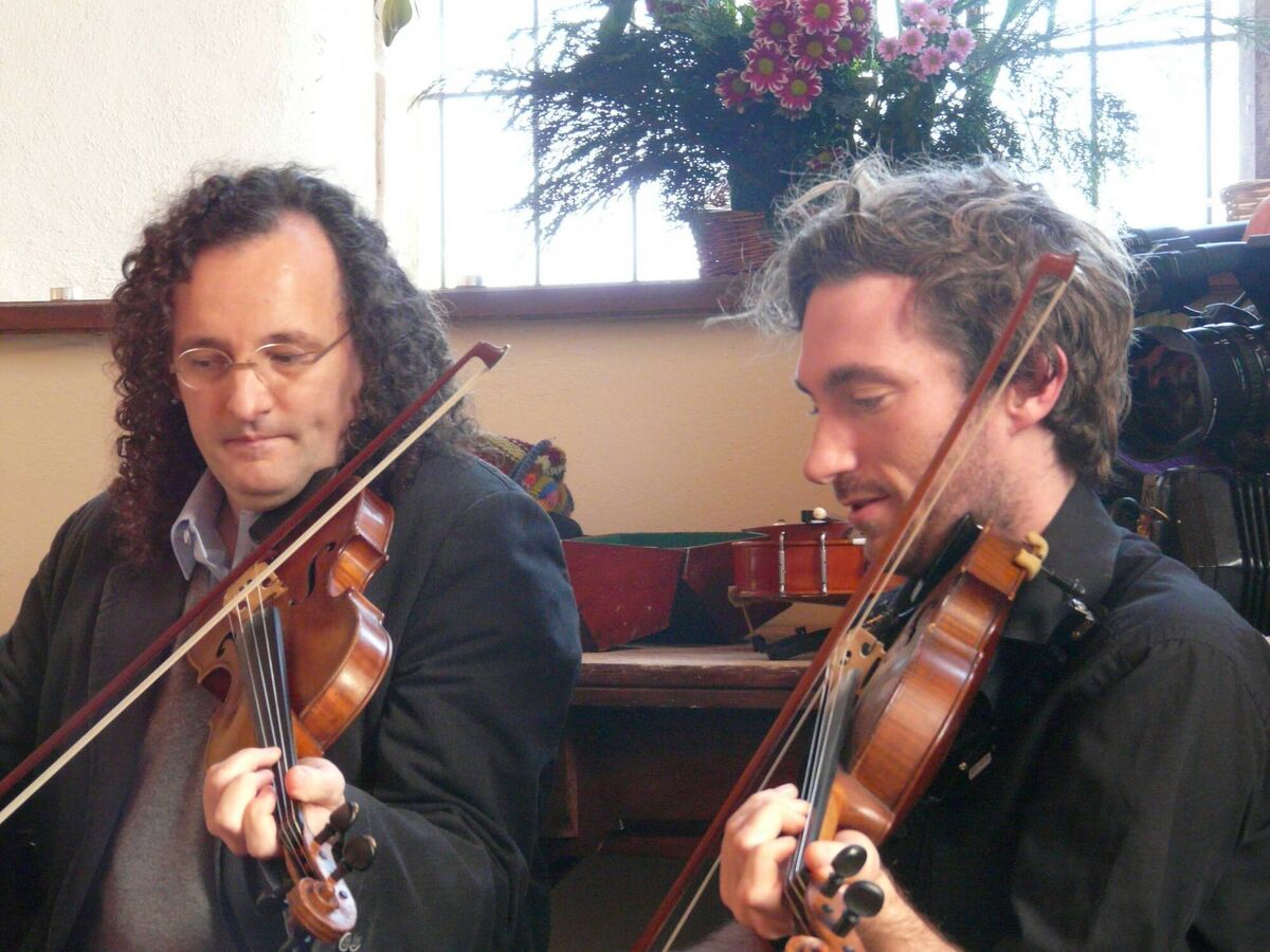 The Éigse weekend has drawn some of the biggest names in traditional music every year. Martin Hayes and Caoimhín Ó Raghallaigh of The Gloaming and Triúr featured one year. Here they are playing a recital at the old Church of Ireland building in Reilig Ghobnatan/St. Gobnait's Cemetery. 
