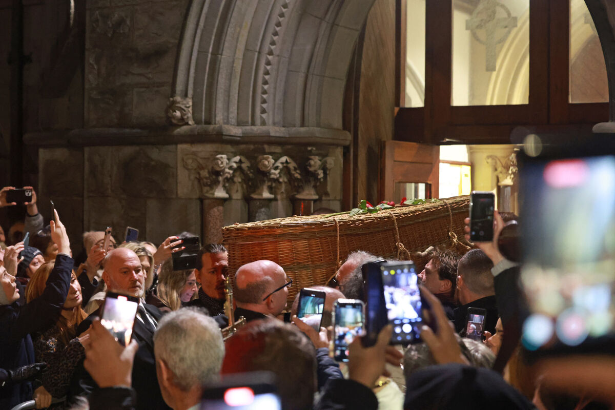 Johnny Depp (centre left) carries the coffin of Shane MacGowan following his funeral at Saint Mary's of the Rosary Church, Nenagh, Co. Tipperary. MacGowan, who found fame as the lead singer of London-Irish punk/folk band The Pogues, died at the age of 65 last week. Photo: Damien Eagers/PA Wire Johnny Depp (centre left) carries the coffin of Shane MacGowan following his funeral at Saint Mary's of the Rosary Church, Nenagh, Co. Tipperary. MacGowan, who found fame as the lead singer of London-Irish punk/folk band The Pogues, died at the age of 65 last week. Photo: Damien Eagers/PA Wire