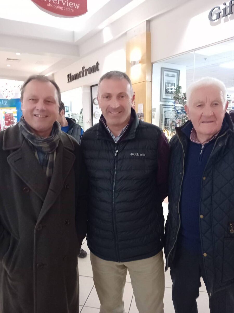 Former Cork footballer Con 'Paddy' O'Sullivan (right) and his son Diarmuid (middle) with former player Tony Davis at the launch of Cork Football: Game of My Life at Bandon Books Plus.