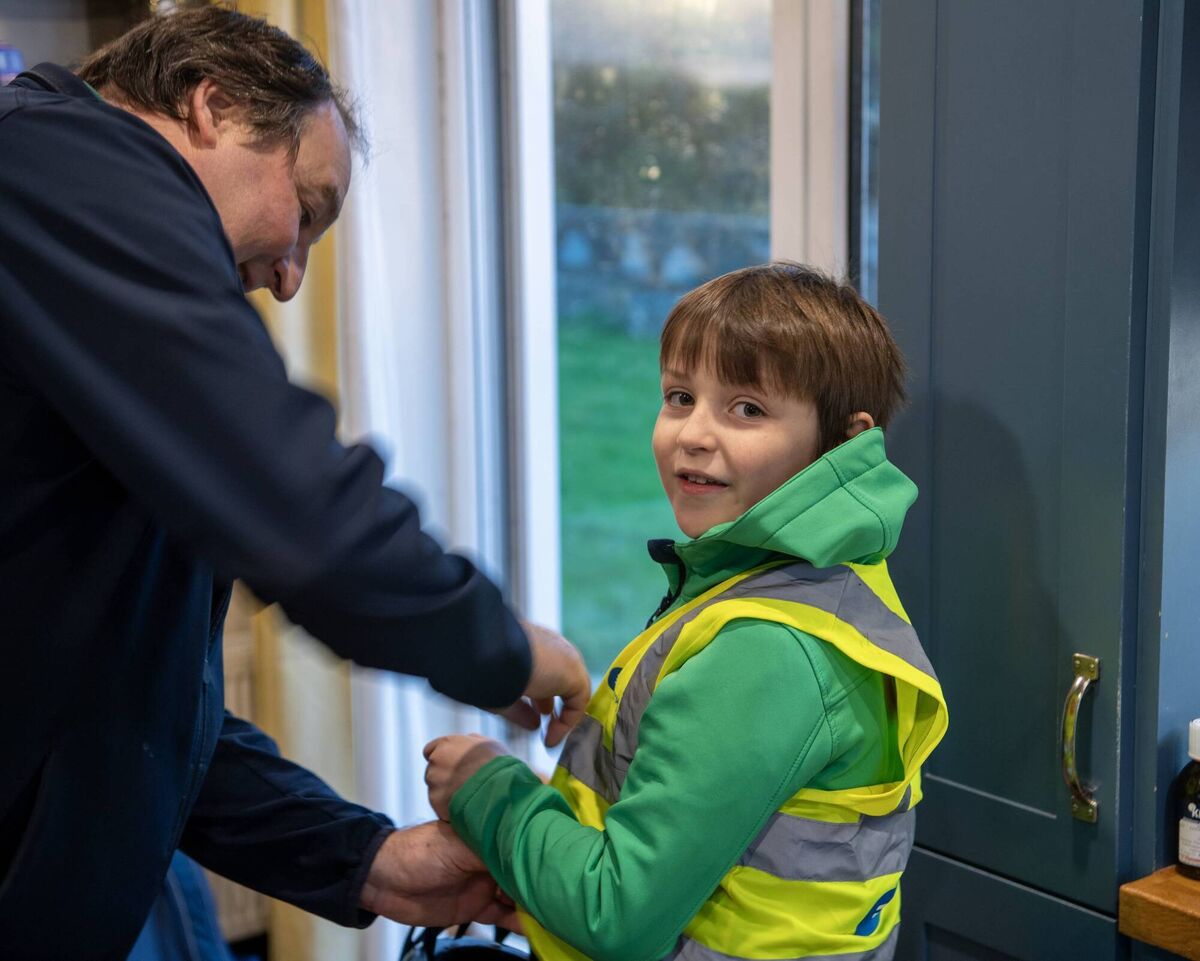 Dad Alan Browne from Fenit, Co Kerry, helps Diarmuid get set for his cycle to St Brendan's National School Fenit on their bikes each day on the Fenit Greenway. Photos: Domnick Walsh Dad Alan Browne from Fenit, Co Kerry, helps Diarmuid get set for his cycle to St Brendan's National School Fenit on their bikes each day on the Fenit Greenway. Photos: Domnick Walsh