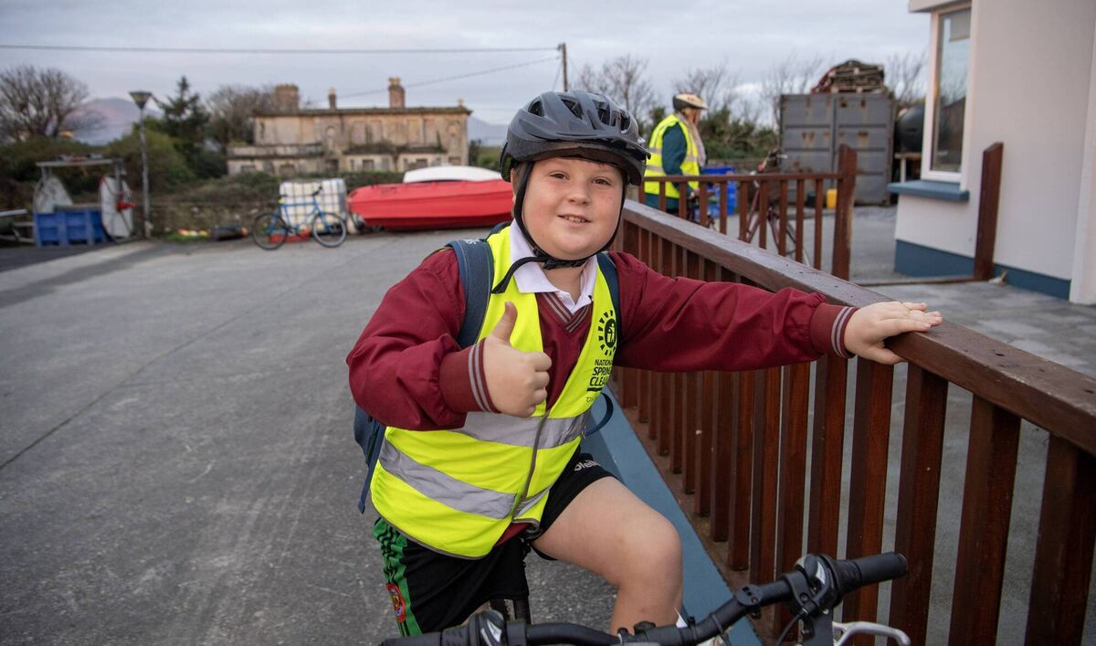 Thomas is ready for his daily cycle to school. Thomas is ready for his daily cycle to school.