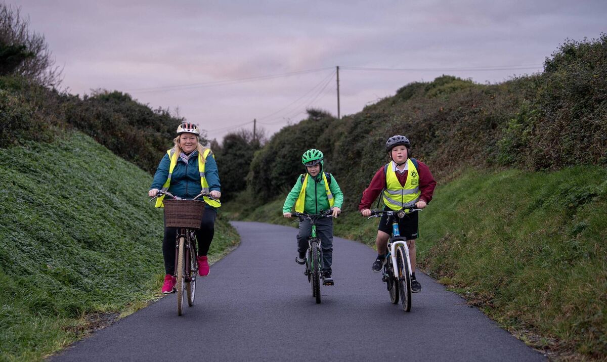 Mary and her boys are delighted to get out of their car and cycle instead. Mary and her boys are delighted to get out of their car and cycle instead.