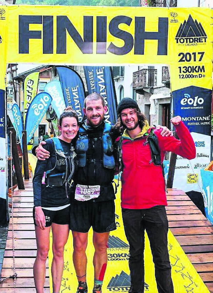 Paul Tierney (centre) with his partner Sarah McCormack, and Joe Mann at the finish line of a race. Picture: Florian Schultz 