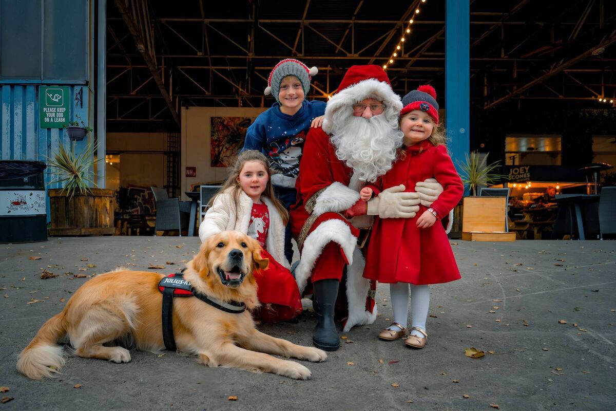 Ciara Murphy (5), Cillian Buckley (9) and Fiadh Murphy (4) pictured with Santa Claus and Rocket the dog in the Marina Market. Picture: Chani Anderson @capturesbychani Ciara Murphy (5), Cillian Buckley (9) and Fiadh Murphy (4) pictured with Santa Claus and Rocket the dog in the Marina Market. Picture: Chani Anderson @capturesbychani