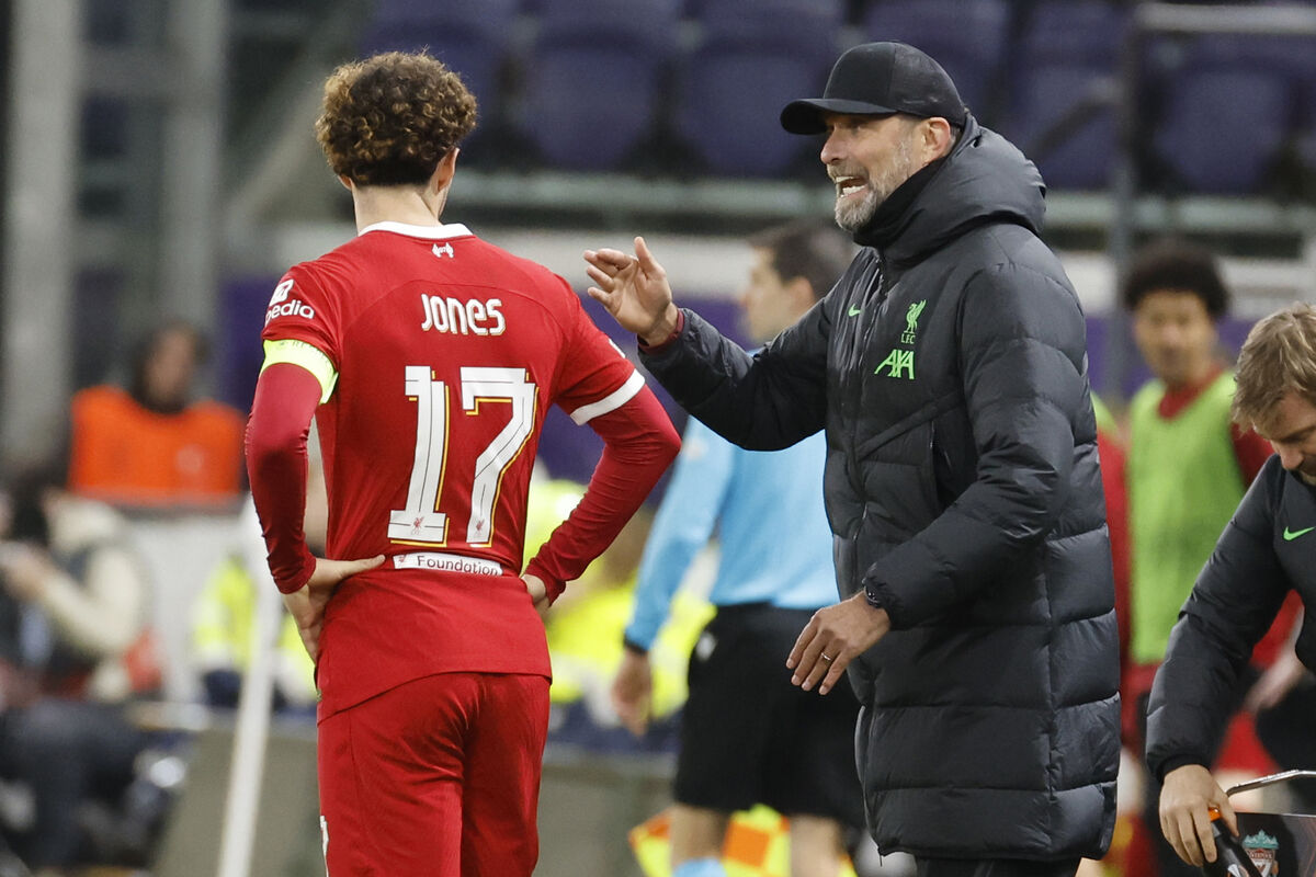Liverpool's manager Jurgen Klopp talks with Curtis Jones during the Europa League Group E defeat to  Union SG  at the RSC Anderlecht stadium in Brussels, Picture: AP Photo/Geert Vanden Wijngaert