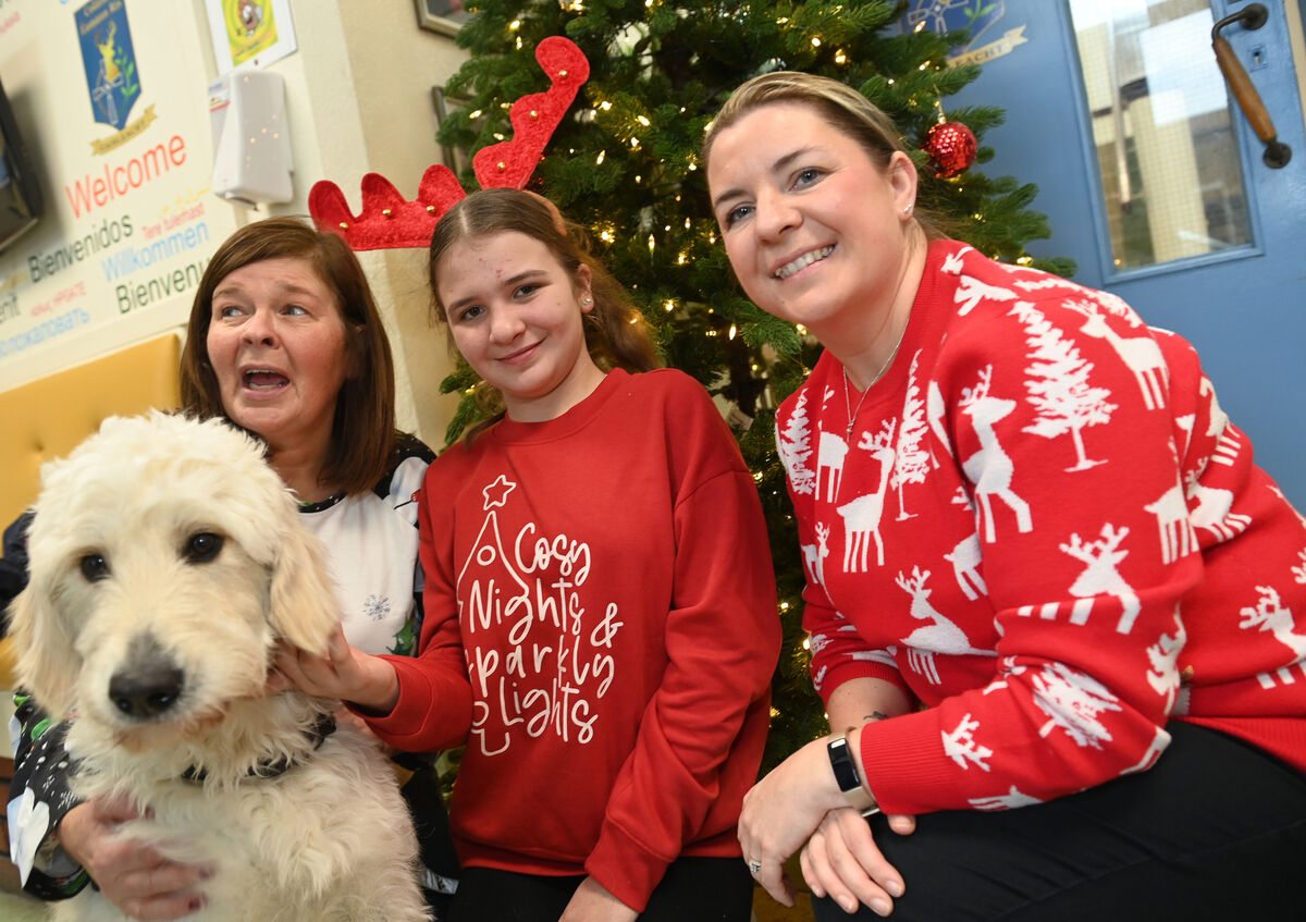 Companion dog Korra,with pupil Saffia and staff members Liz Nunan and Karen Buckley at the Christmas lunch at Colaiste Eamann Ris. Pic Larry Cummins Companion dog Korra,with pupil Saffia and staff members Liz Nunan and Karen Buckley at the Christmas lunch at Colaiste Eamann Ris. Pic Larry Cummins