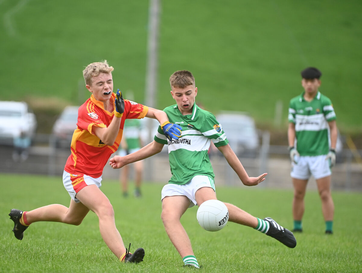 Michael O'Riordan, Éire Óg,  puts in a block on Eoghan Healy, Macroom, in the 2022 Premier 2 U15 final. Picture: Larry Cummins