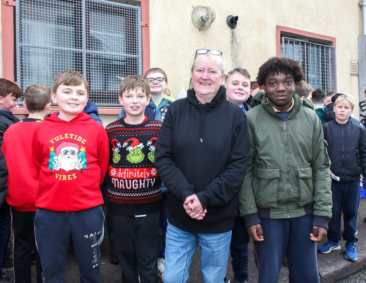 Caitríona Twomey of Penny Dinners with some of the pupils of Blarney Street National School on Little Hanover Street, Cork.- Picture: David Creedon