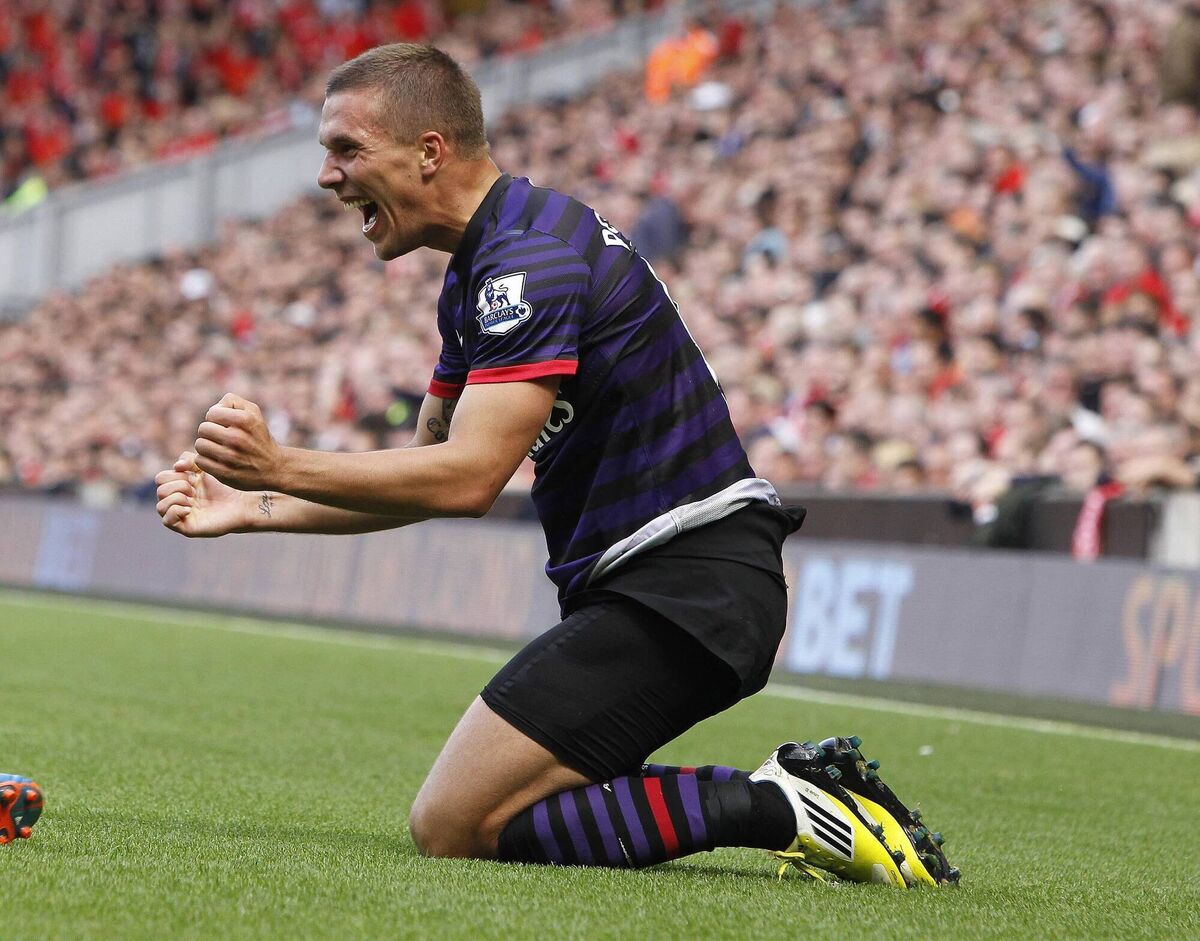 Arsenal's Lukas Podolski celebrates his goal during the Barclays Premier League match at Anfield, Liverpool back in September 2, 2012. Picture: Peter Byrne/PA Wire. Arsenal's Lukas Podolski celebrates his goal during the Barclays Premier League match at Anfield, Liverpool back in September 2, 2012. Picture: Peter Byrne/PA Wire.
