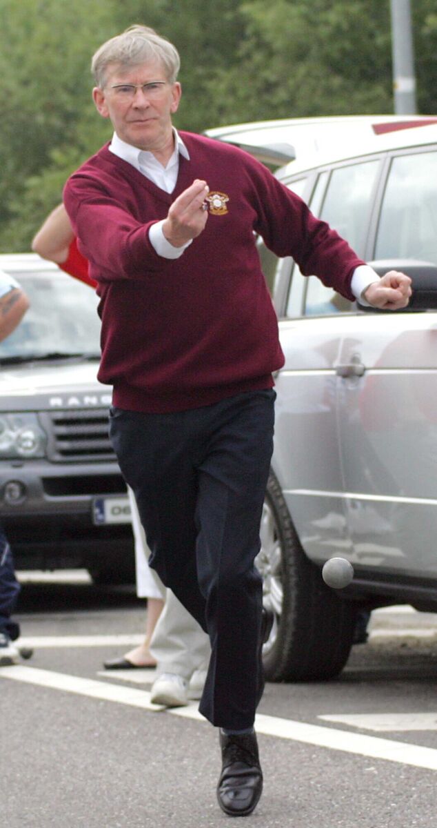 LET US PLAY: Bishop Buckley displays his prowess at road bowling LET US PLAY: Bishop Buckley displays his prowess at road bowling