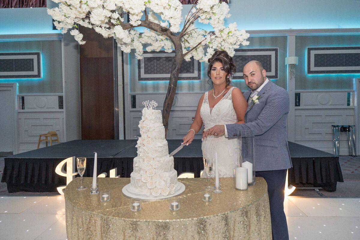 The couple enjoyed their civil ceremony in the Radisson Blu in Little Island, where they continued their wedding reception. The five tier cake was by Rachel in Healy’s Bakery, Blackpool. It was decorated with pearls and diamantes. The couple enjoyed their civil ceremony in the Radisson Blu in Little Island, where they continued their wedding reception. The five tier cake was by Rachel in Healy’s Bakery, Blackpool. It was decorated with pearls and diamantes.