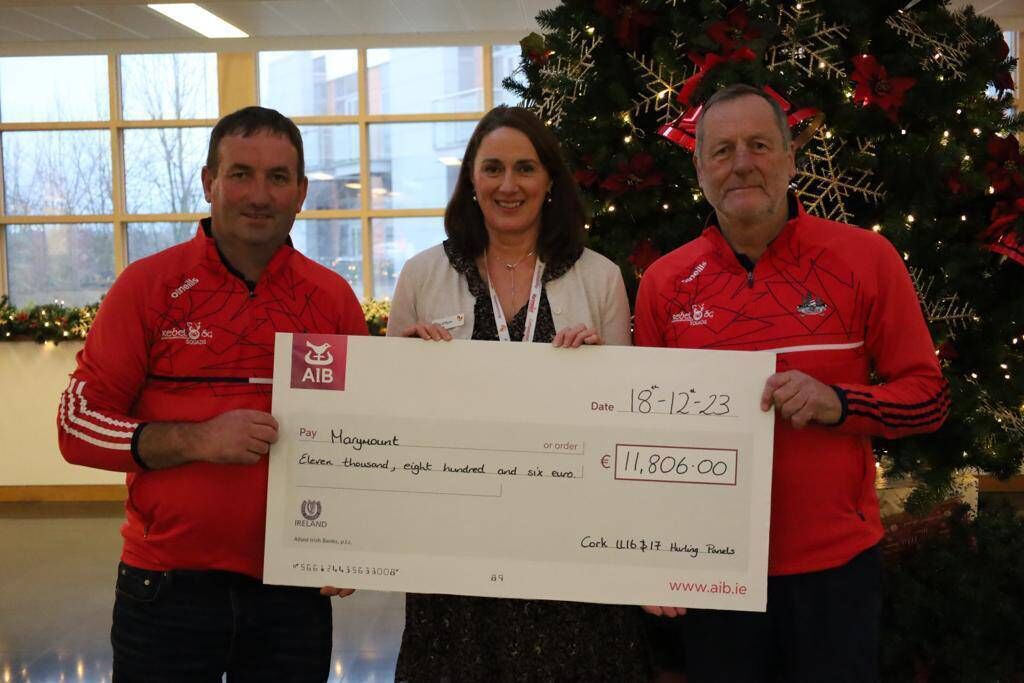 Cork minor selector Mike Mulcahy and manager John Meyler making a presentation to Maire O'Flynn, Marymount, of the funds raised by the U16 and U17 hurlers at a recent poc fada. Cork minor selector Mike Mulcahy and manager John Meyler making a presentation to Maire O'Flynn, Marymount, of the funds raised by the U16 and U17 hurlers at a recent poc fada.