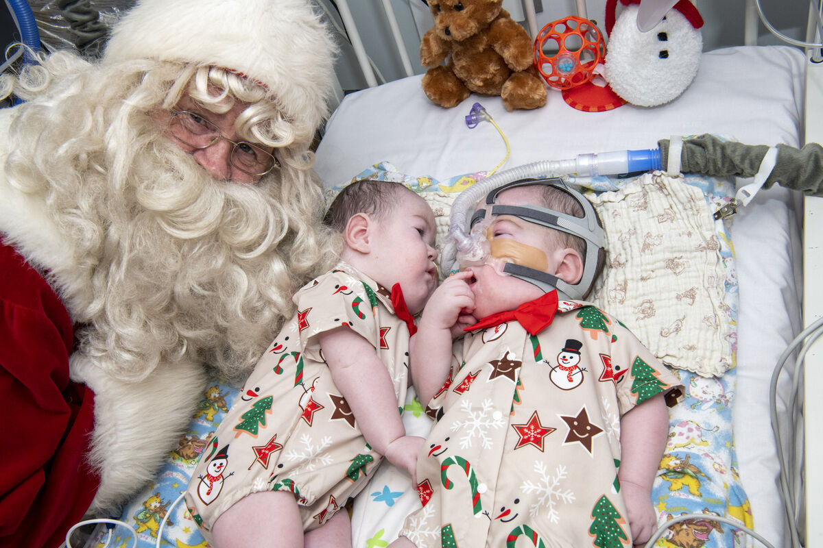 Pictured are five-month-old twins Oisín and Tadhg Relihan with Santa.