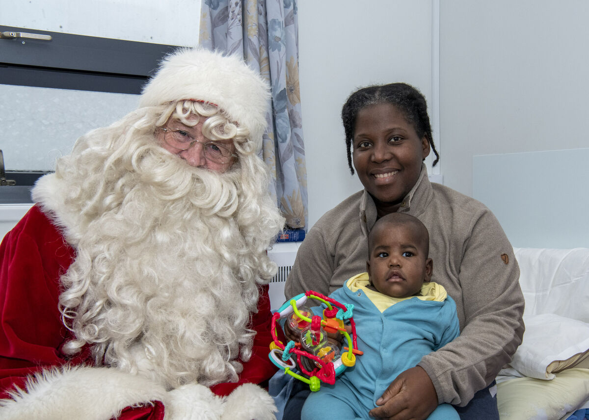Pictured with Santa is six-month-old Dunamis Asifuwah and mum Sazola.