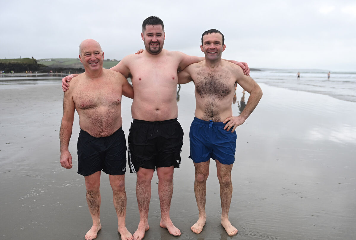  Jim and his son Jamie Kearney and Alan Murray taking part in the 25th annual Dunwanway Christmas swim in aid of the Dunmanway cancer unit CUH at Inchydoney beach in West Cork . Picture: Eddie O'Hare.