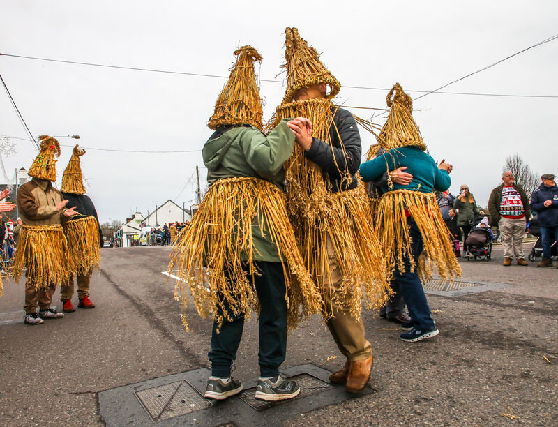Straw Boys dancing on Main Street during the Wren Boys Street Festival that was held on St. Stephen's Day in Carrigaline, Co. Cork. Picture: David Creedon