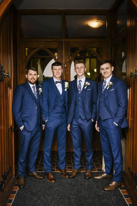 David had his brother Michael and two best friends Mark and Shaun in his wedding party.