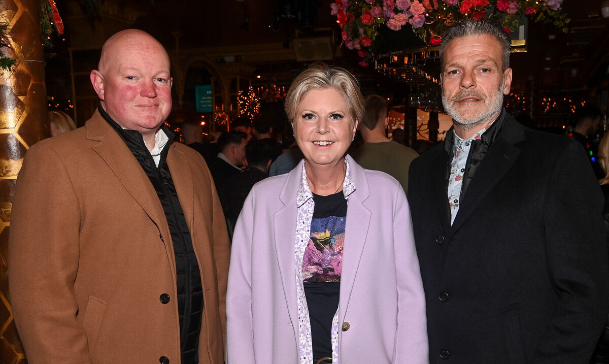  Margaret Kenneally, owner of Reardens along with Fintan Edmonds, security, left and John Styles, general manager, right, at the Reardens All-Stars awards presentation evening on Washington Street.