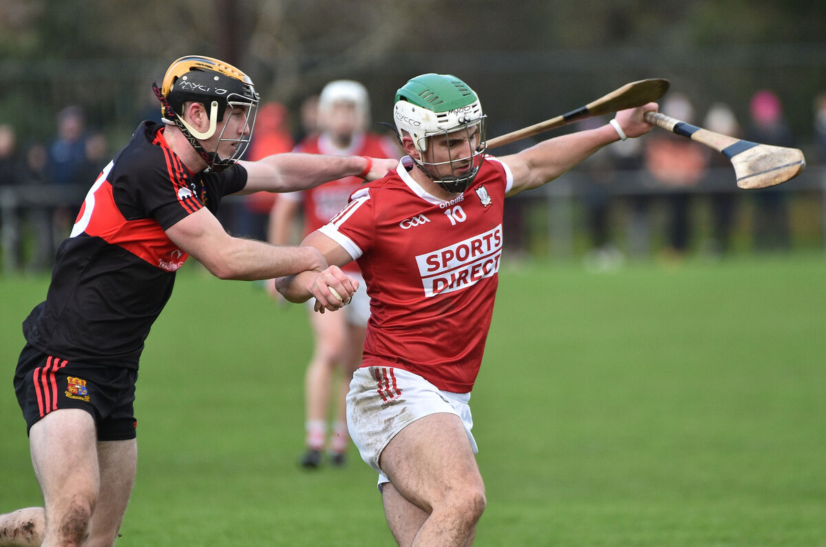 Daniel Hogan of UCC getting in a tackle on Shane Kingston during the annual Canon O'Brien Cup match at the Mardyke, Cork. Picture: Dan Linehan