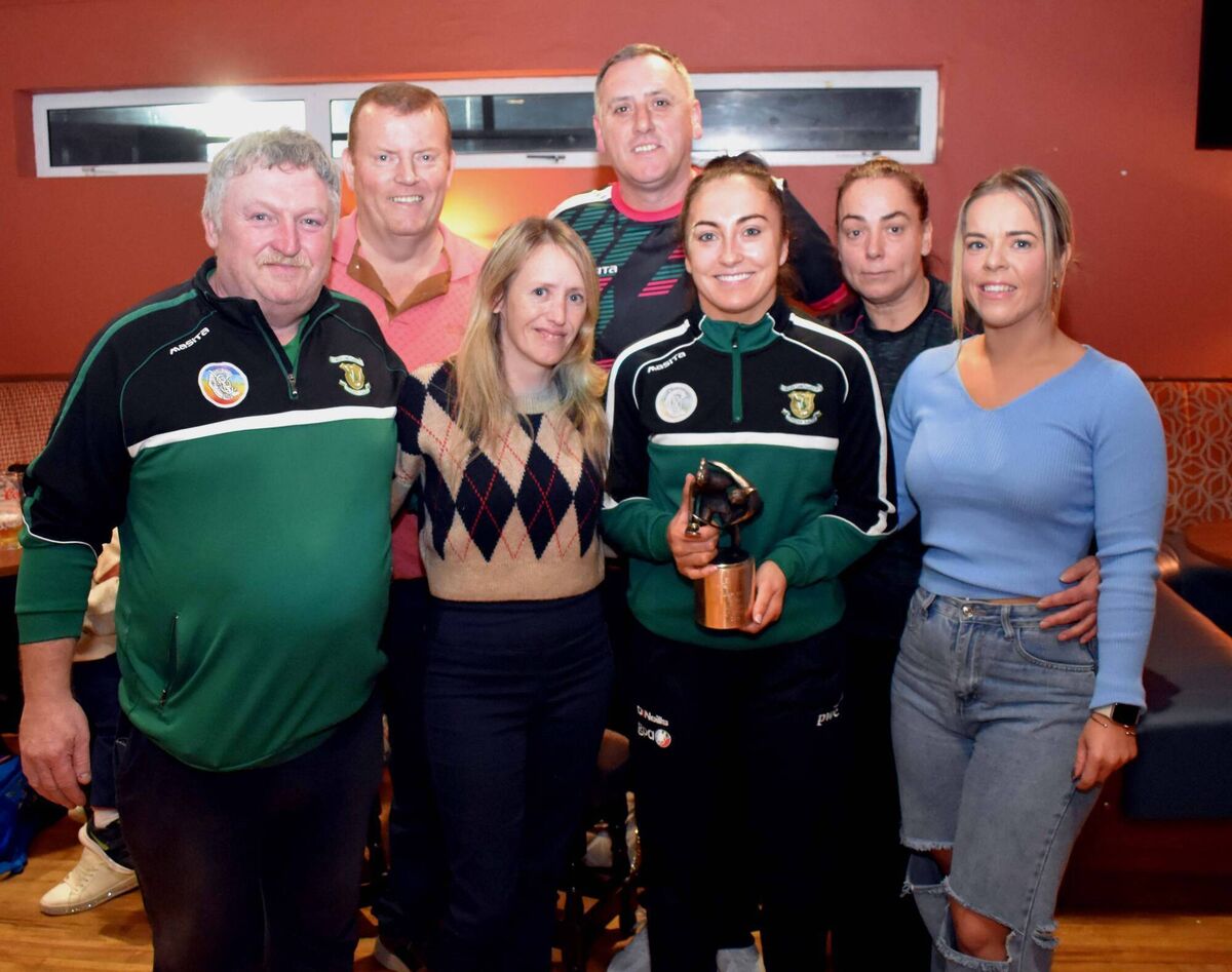 Members of St. Vincent's Camogie Club, Vince Stokes, William Walsh, Gwen Fitzpatrick, Don O'Sullivan, Amanda Harris and Gillian Kelly welcoming PwC Camogie All Star, Amy O'Connor, to the reception in her honour at the club. Picture: Mike English