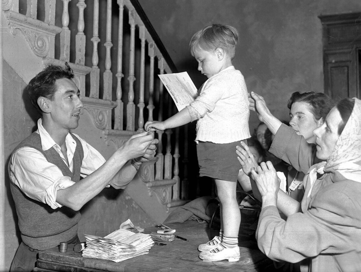 A young extra holding an artist salary voucher receives his payment on the set of the film 'Moby Dick' at Youghal A young extra holding an artist salary voucher receives his payment on the set of the film 'Moby Dick' at Youghal