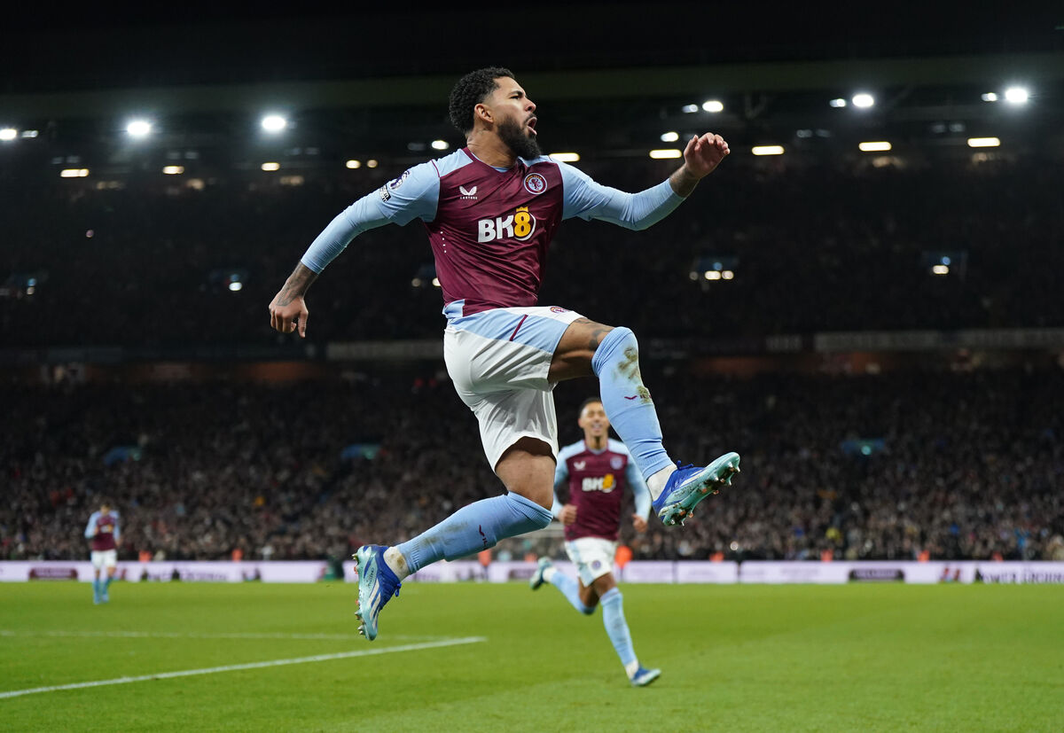 Aston Villa's Douglas Luiz celebrates after scoring his sides third goal of the game during the Premier League match at Villa Park, Birmingham. 