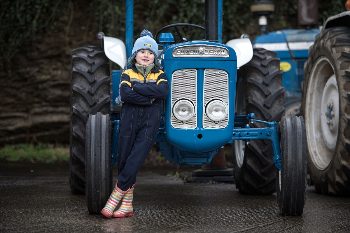 Five-year-old Eva Kingston stands next to this Super Dexta vintage tractor as she watches the annual tractor run in Kilbrittain, Cork. Picture Dan Linehan Five-year-old Eva Kingston stands next to this Super Dexta vintage tractor as she watches the annual tractor run in Kilbrittain, Cork. Picture Dan Linehan