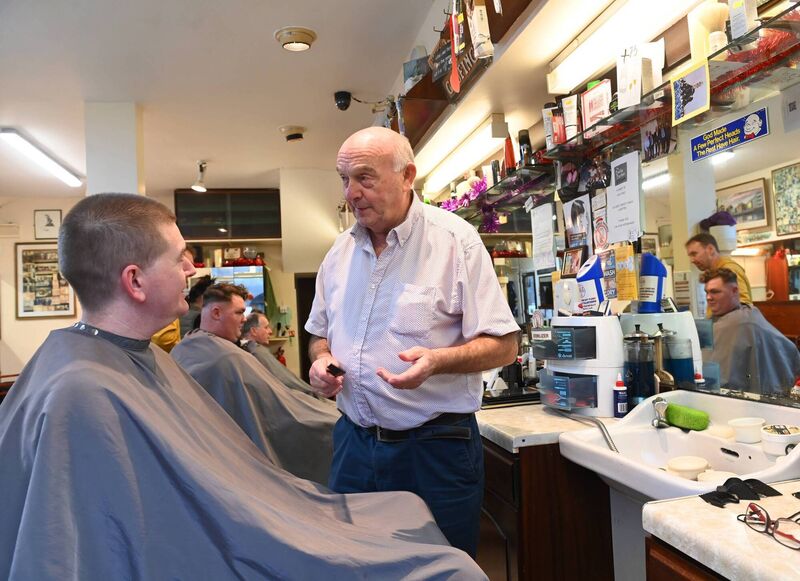Mick Moriarty chatting with a customer in the premises in Blackpool. Pic Larry Cummins