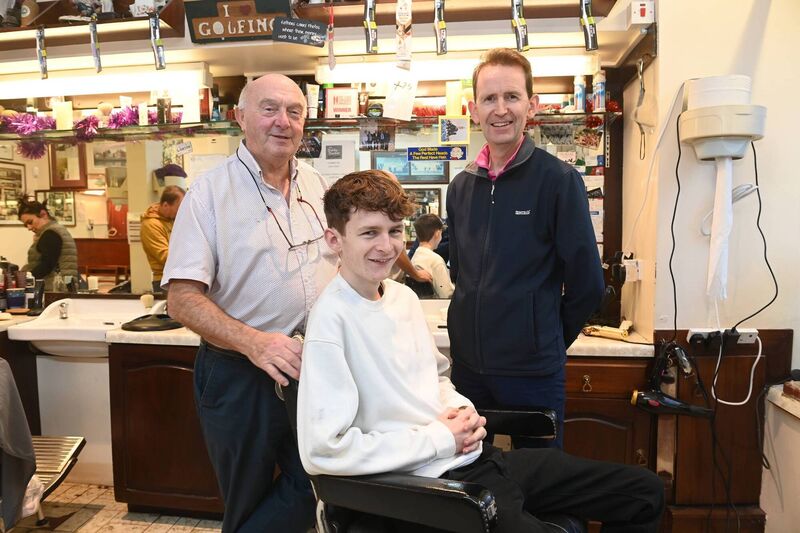 Mick Moriarty with regular customers Mark (seated) and his father Conor Delaney who has been a customer for nearly twenty years, at the premises in Blackpool. Pic Larry Cummins