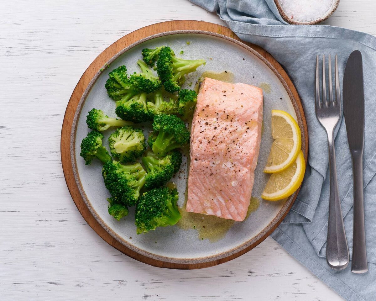 A plate of salmon and broccoli A plate of salmon and broccoli
