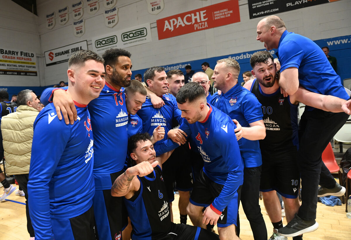  UCC Demons celebrate the win at the end of overtime over Neptune. Picture: Larry Cummins