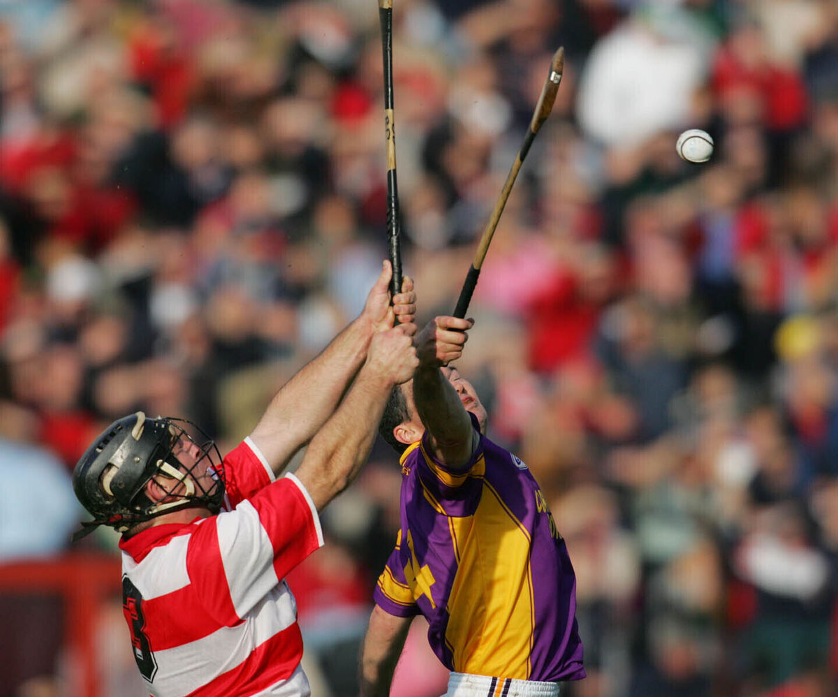 Denis Walsh battles Brian Downing of Courcey Rovers in the 2004 county Premier IHC final. Picture: Neil Danton