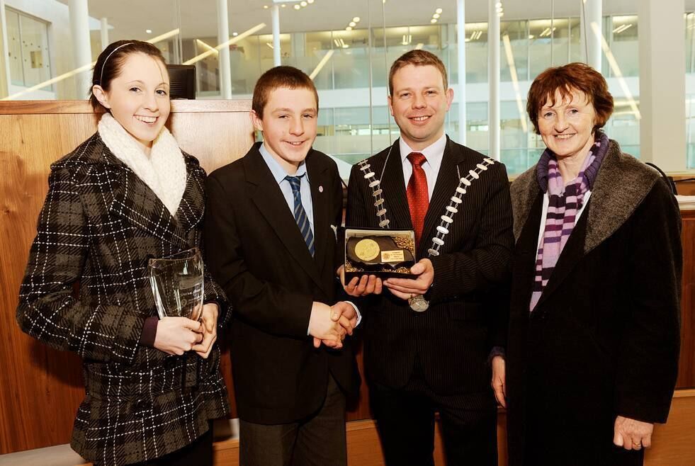 Pictured in 2009: The Mayor of Cork County Cllr Noel Harrington making a special presentation to Kinsale Community School student John D. O'Callaghan from Ballymartle, Riverstick, in recognition of jointly winning the Young Scientist of the Year Award. Also included are his mother and his sister. Photo: Billy macGill 