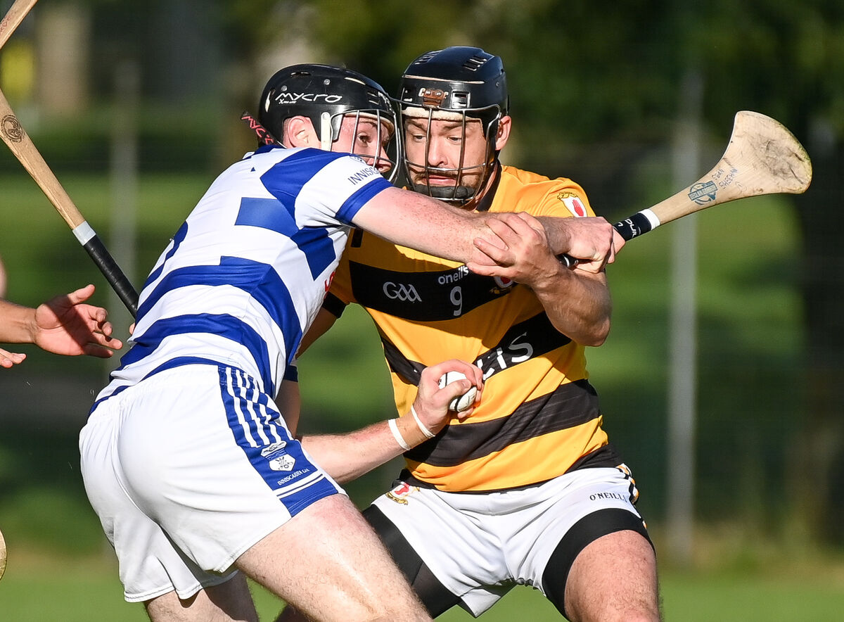  Inniscarra's Seán Sheehan keeps possession under pressure from Na Piarsaigh's Eoin Moynihan during their SAHC match at Ballincollig last year. Picture: David Keane