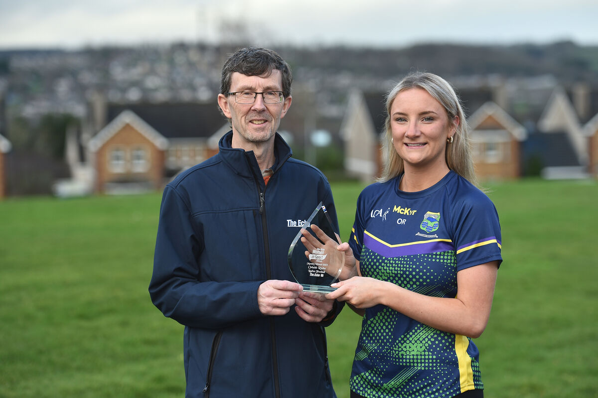  Rory Noonan, chief sub-editor, The Echo, making a presentation to Glanmire ladies footballer Orlaith Roche who is this month's winner of The Echo Women in Sport award. Picture: Dan Linehan
