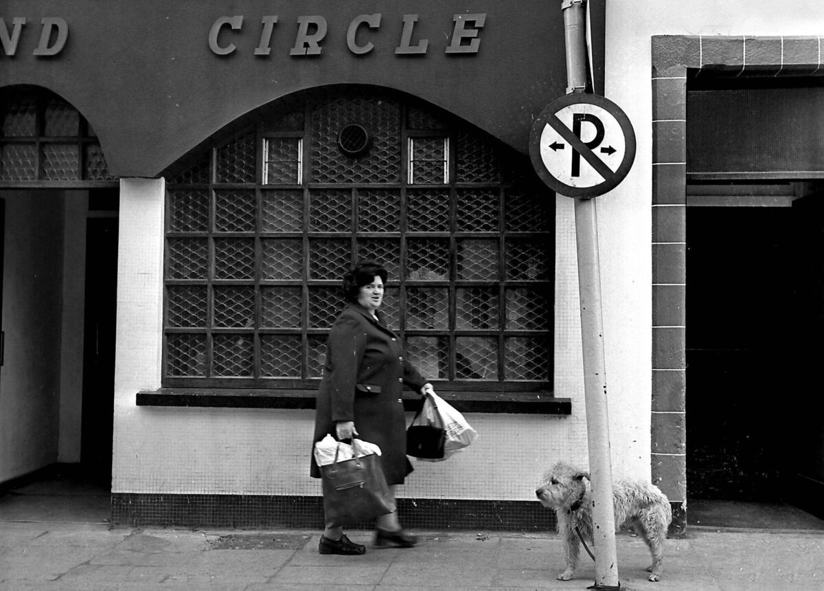 A dog waiting for his master outside the Grand Circle Bar on Drawbridge Street, Cork, in May, 1977. It was demolished in 2007 to make way for the Academy Street/Opera Lane shopping development 