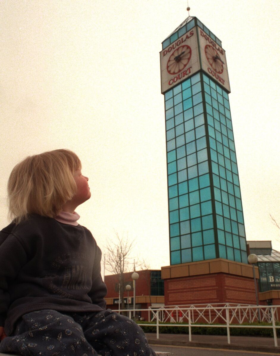 Shannon Bateman from Riverstick looking up at the clock tower at Douglas Court Shopping Centre in 1998. Picture: Denis Minihane