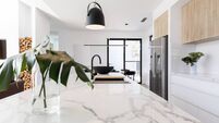 Kitchen marble bench close up with black hanging pendant