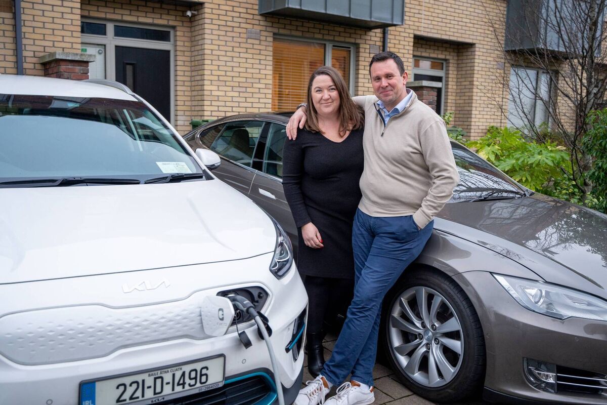 Lisa and John with both their EVs. Lisa and John with both their EVs.