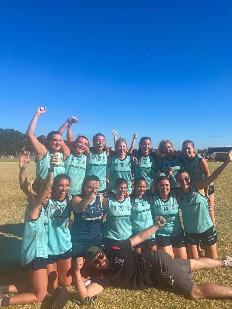 Amy Waters third from the right in the back row with her Garyowen Gaelic Football team in Australia: