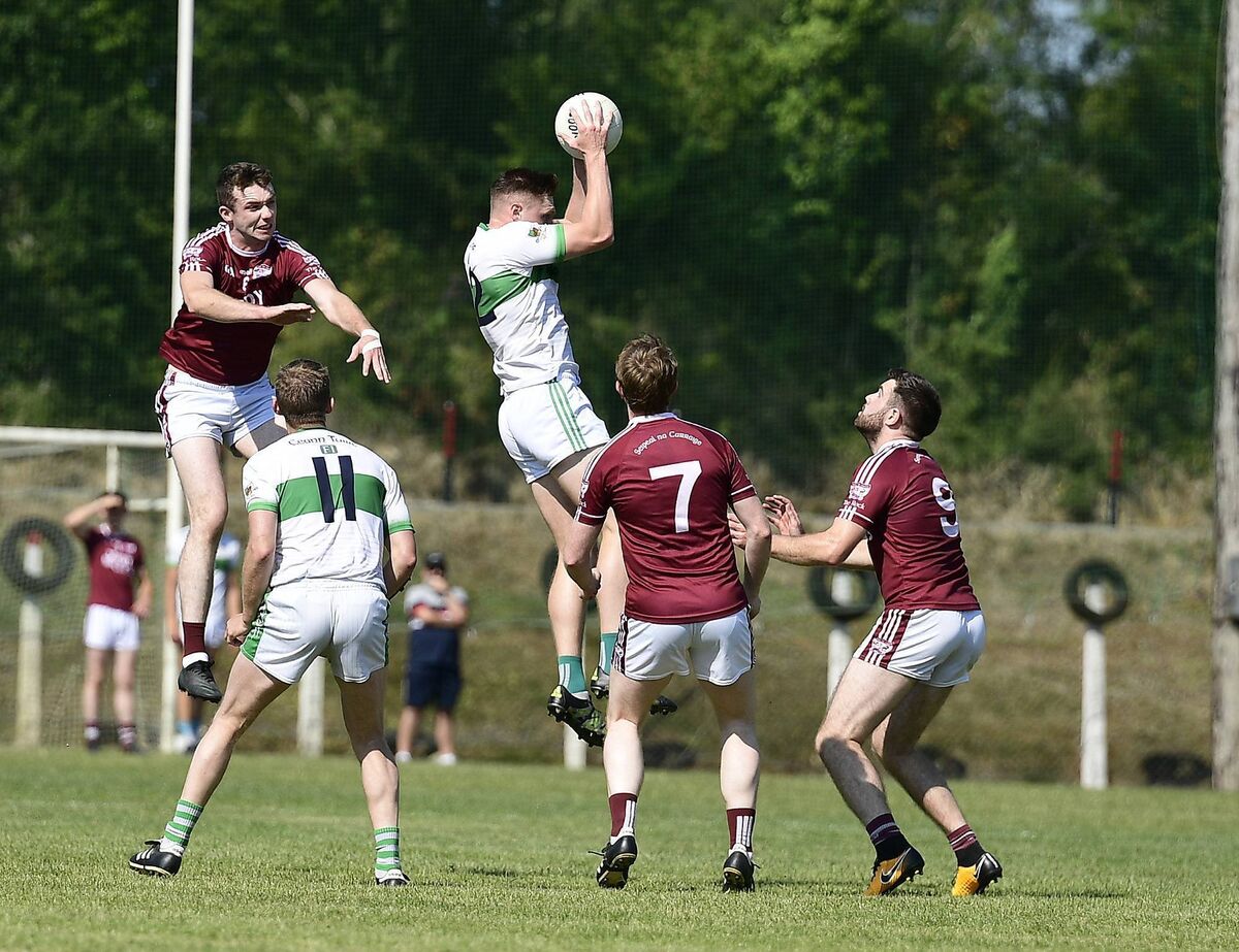 Kanturk's Ryan Walsh jumps high to win the ball. Picture: John Tarrant Kanturk's Ryan Walsh jumps high to win the ball. Picture: John Tarrant