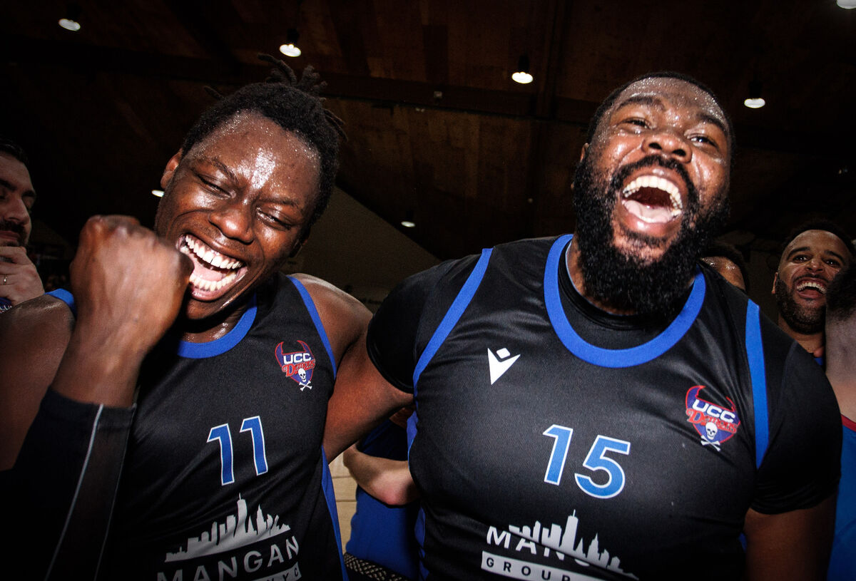 UCC Blue Demons' Tala Fam Thiam and Elijah Tillman celebrate after the game