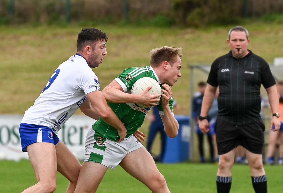 Kildorrery's Dylan Kent tackles Aghabullogue's Ryan Dennehy. Picture: David Keane