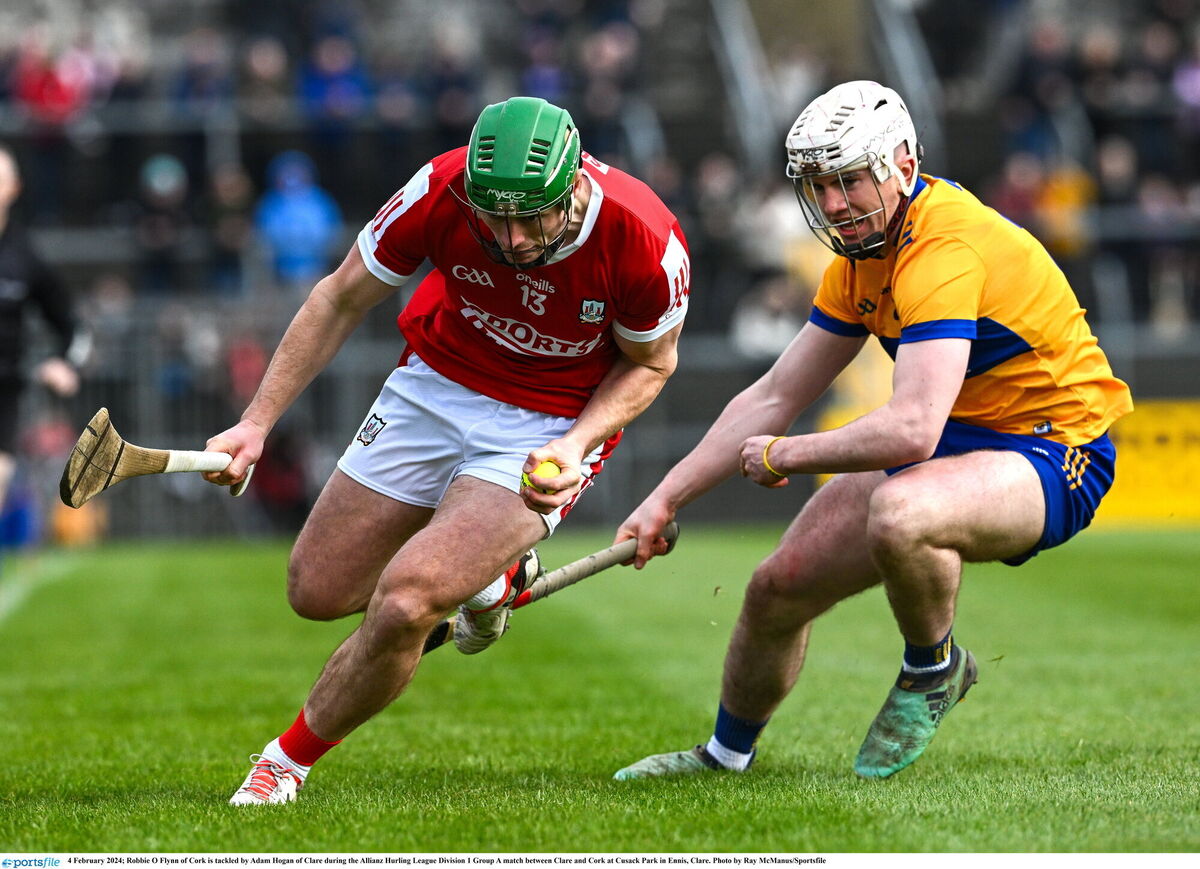 Robbie O'Flynn of Cork tries to get past Clare's Adam Hogan. Picture: Ray McManus/Sportsfile Robbie O'Flynn of Cork tries to get past Clare's Adam Hogan. Picture: Ray McManus/Sportsfile