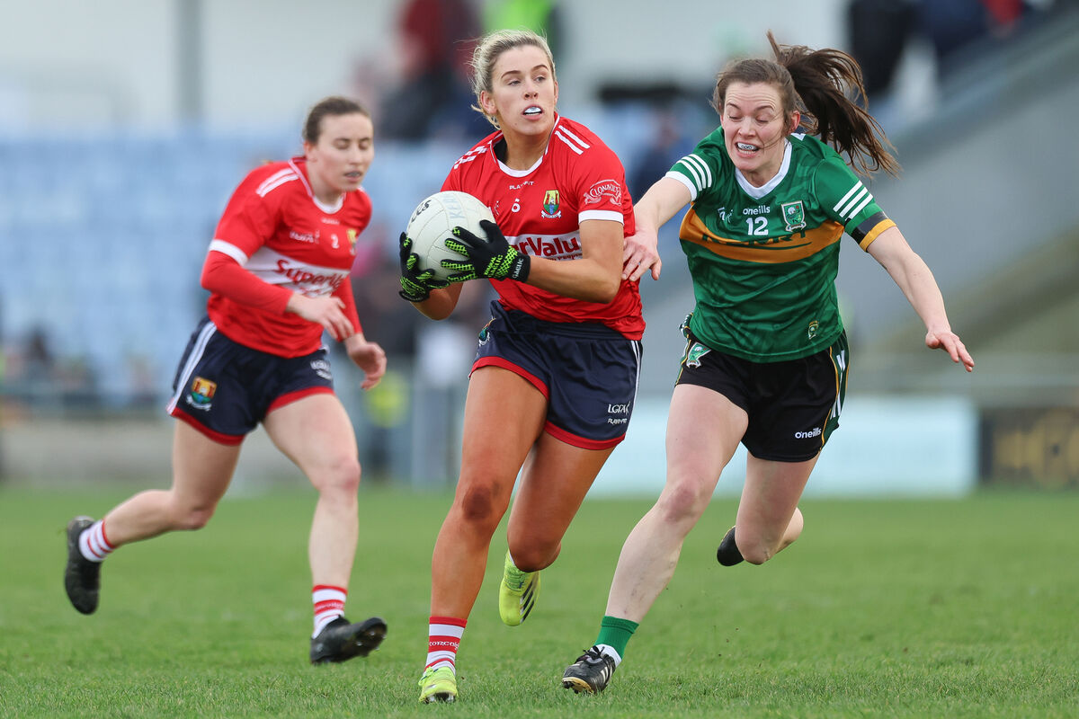 Maire O'Callaghan of Cork in action against Anna Galvin of Kerry Maire O'Callaghan of Cork in action against Anna Galvin of Kerry